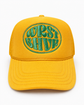 Mustard Trukas WRST BHVR trucker hat with green embroidered logo, foam front, mesh back, made in LA